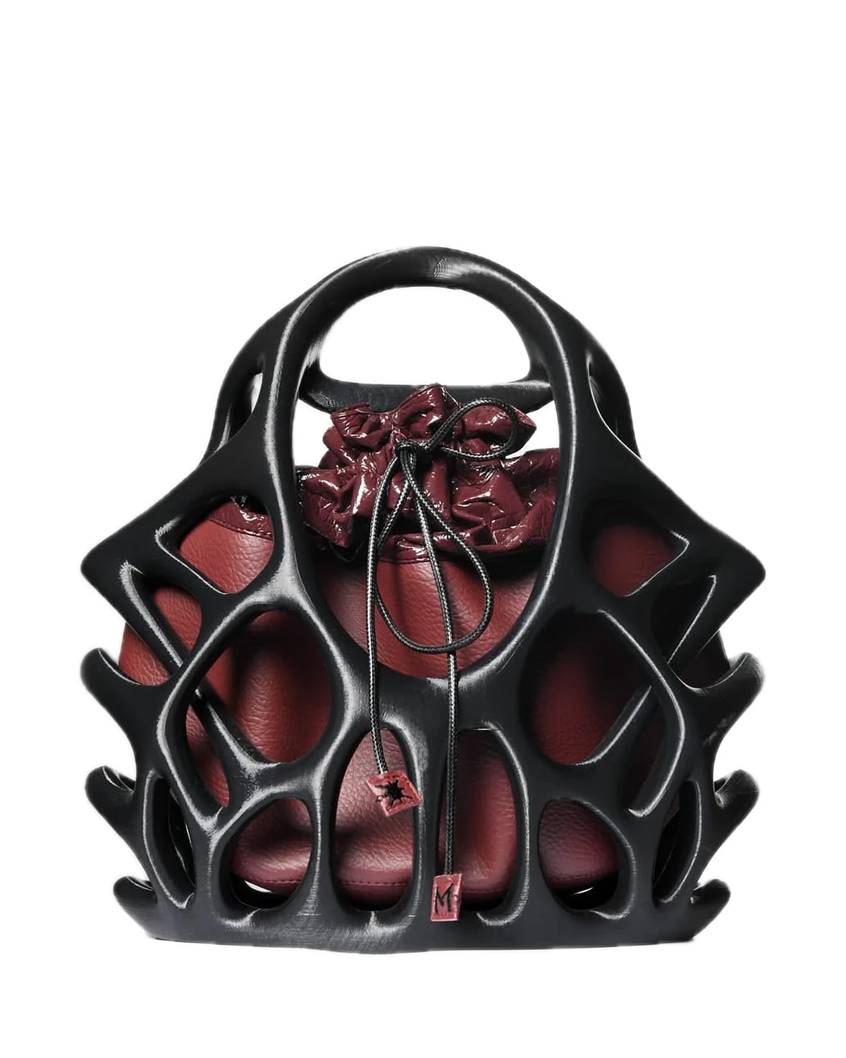 Naomi Cage Bag: black skeletal cage with a top handle around a burgundy pouch.